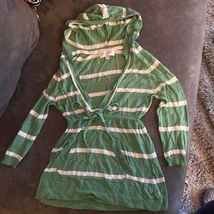 Green and white striped shirt. Ties in front. Has a hood. Size small
